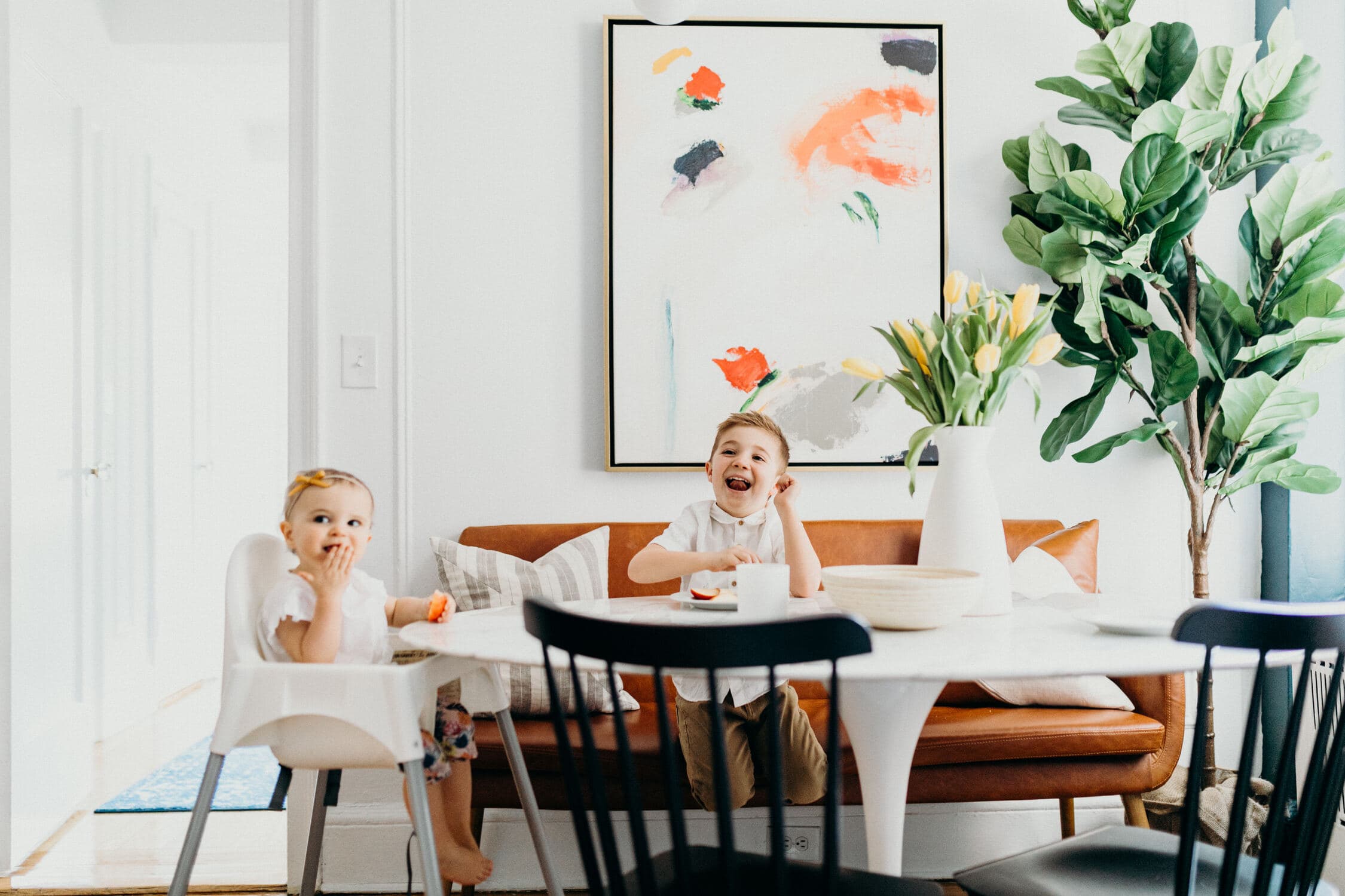 kids eating at modern table with urban outfitters leather couch